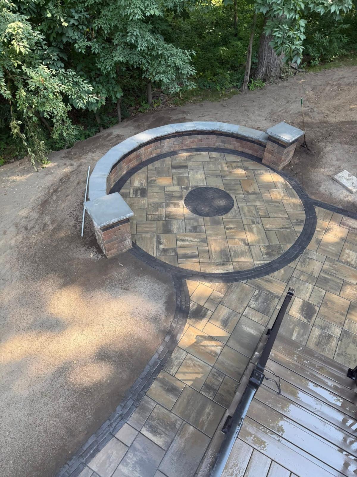 Circular paver patio with fire pit & seating wall
